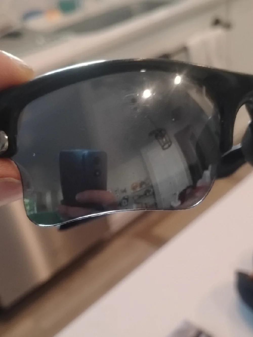 Oakley Black Frame Sunglasses with Gray And Orange Lenses